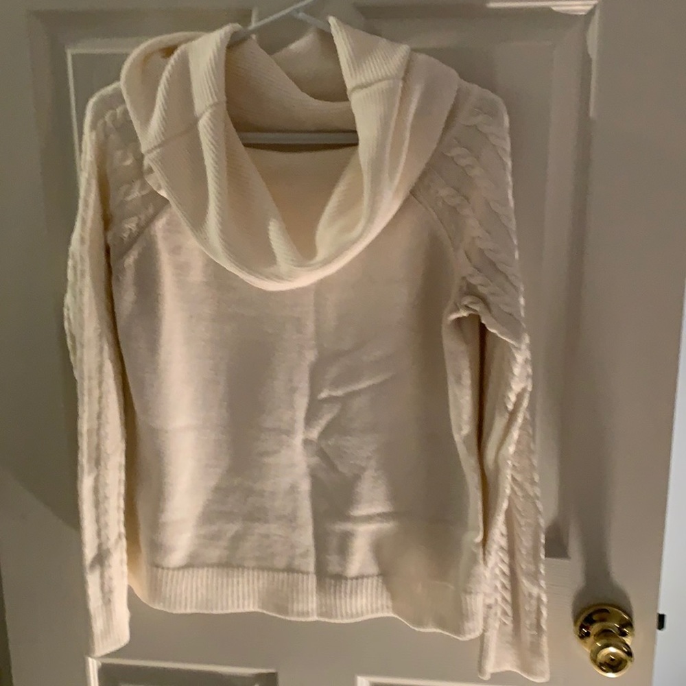 Cream sweater with cable arms